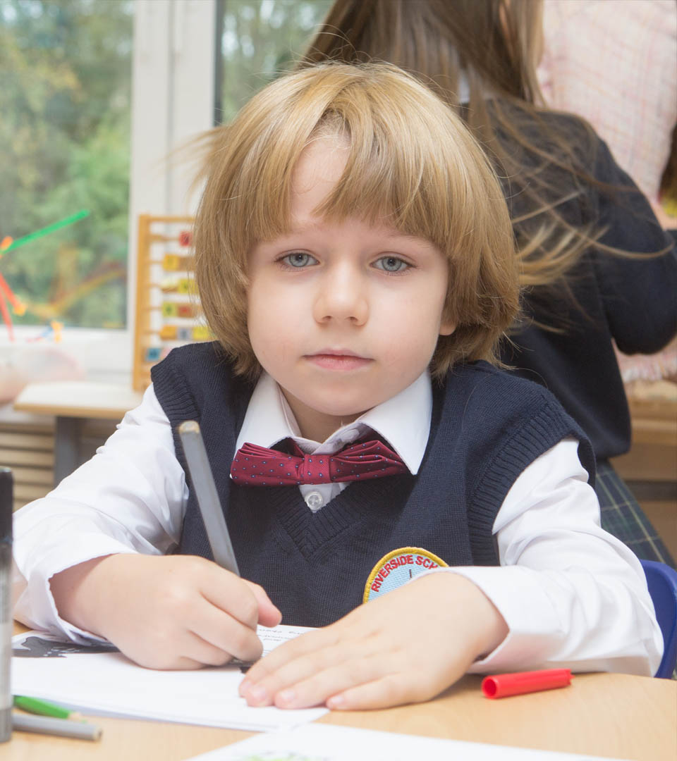 A Riverside School pupil working at a desk