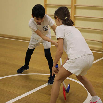 Children playing in the Riverside School sports hall